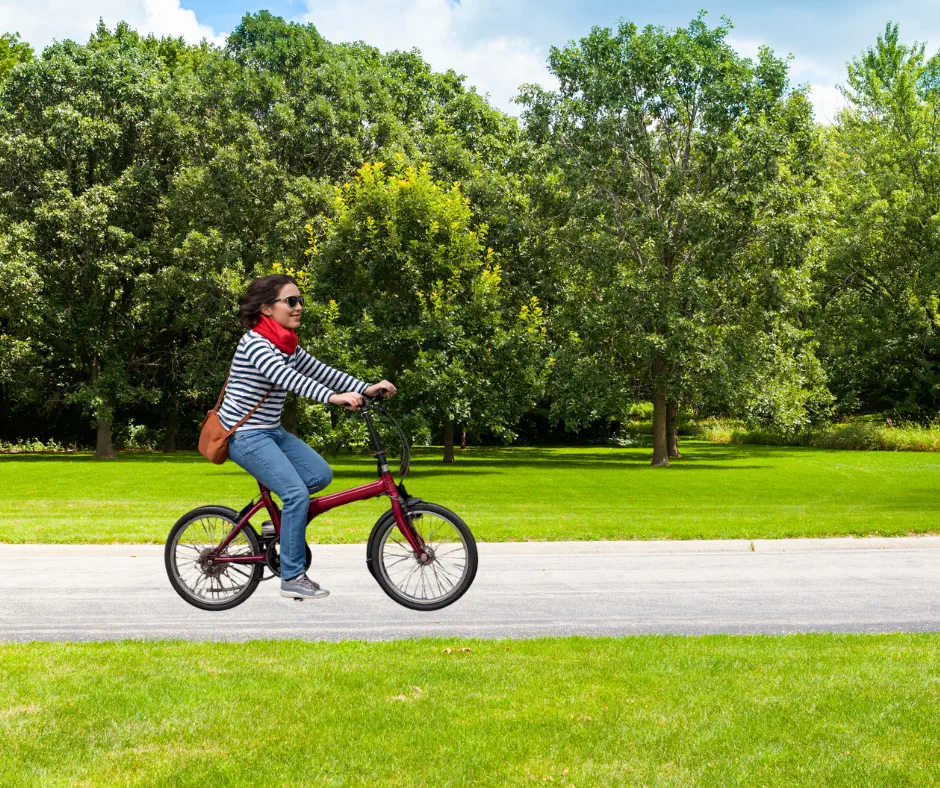 Women riding F20-JJ 20-inch folding bike on a country road